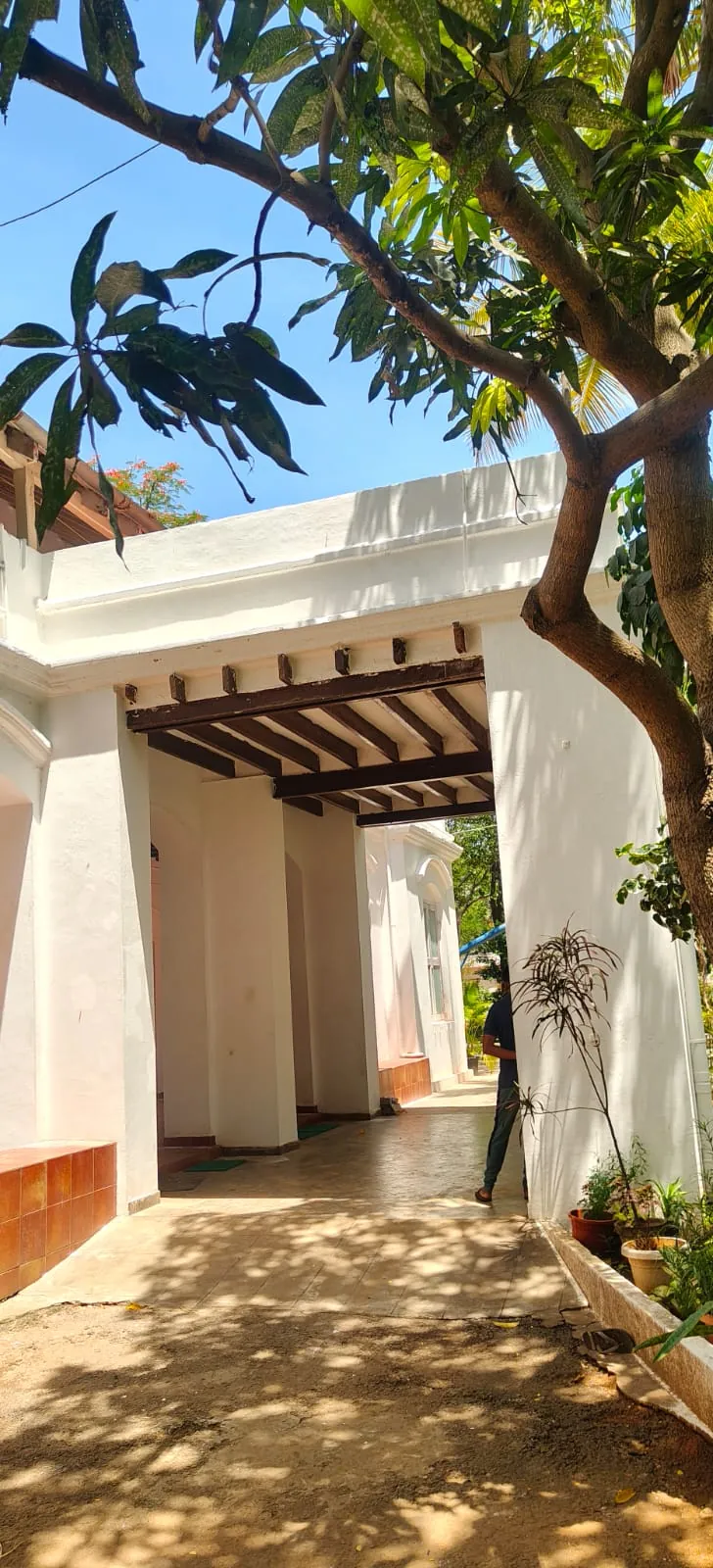 Shaded exterior passage with freshly finished compound walls